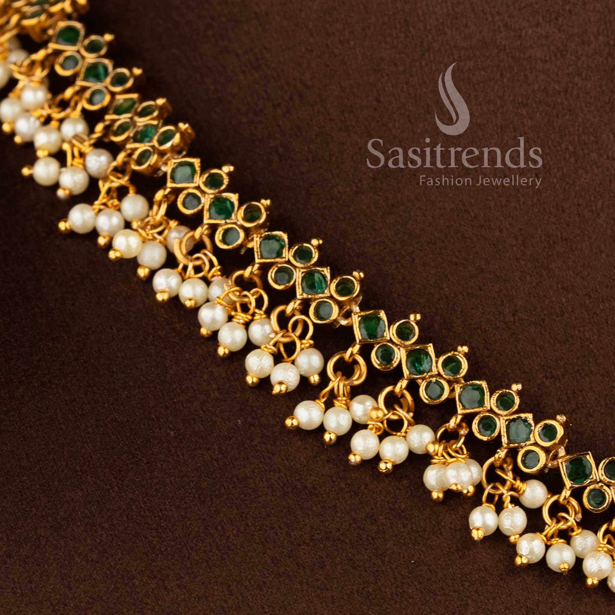 Gorgeous floral pendant temple matte gold plated choker necklace set with AD stones and pearl drops in green by Sasitrends.