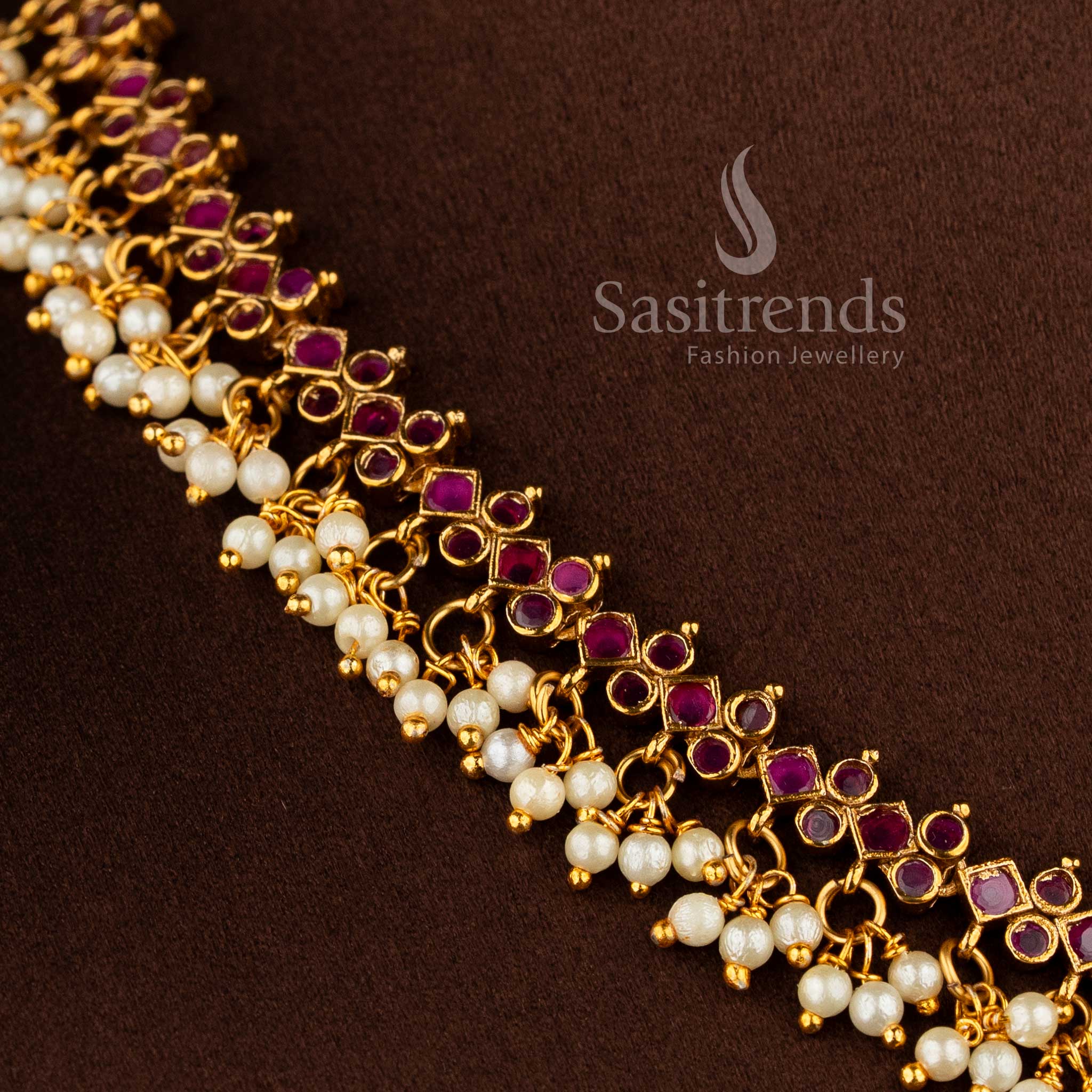 Gorgeous floral pendant temple matte gold plated choker necklace set with AD stones and pearl drops in ruby by Sasitrends.