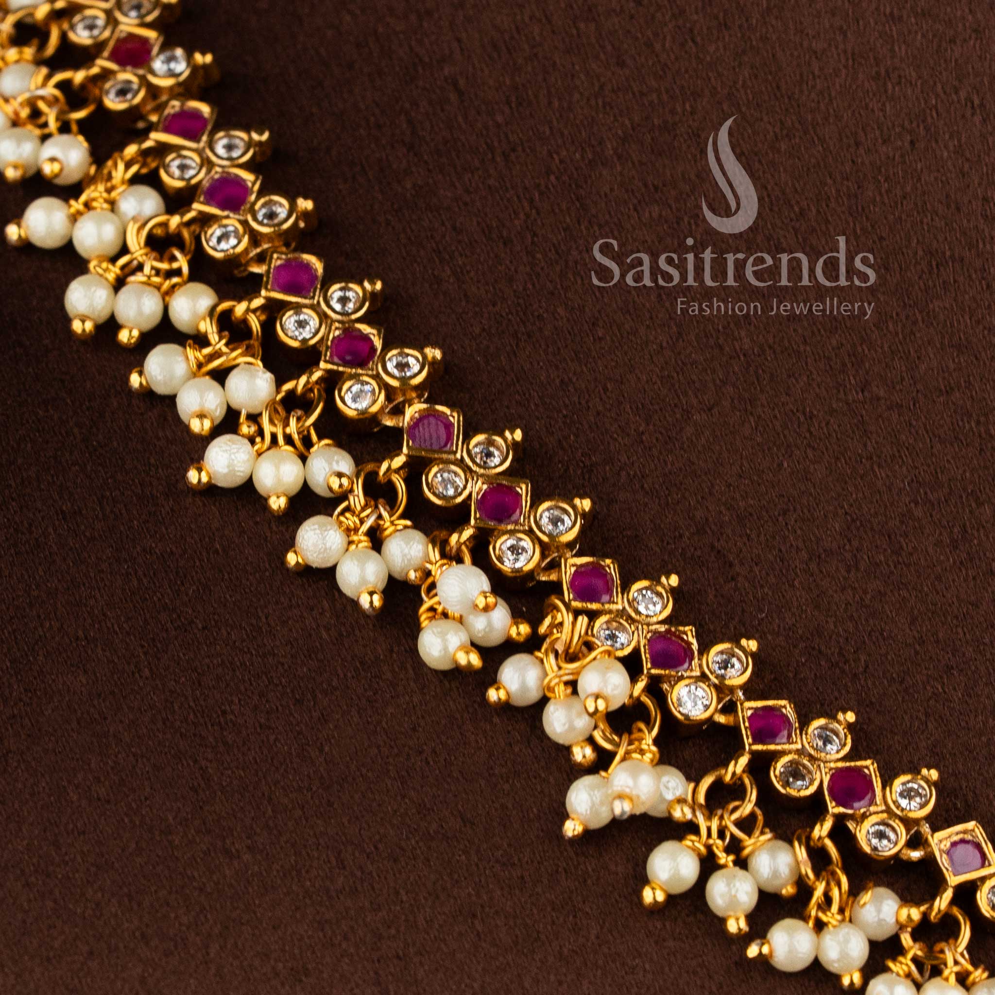 Bridal matte gold peacock necklace set with AD stones and jhumkas in ruby white combination.