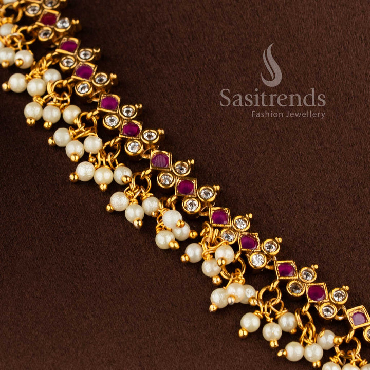 Bridal matte gold peacock necklace set with AD stones and jhumkas in ruby white combination.