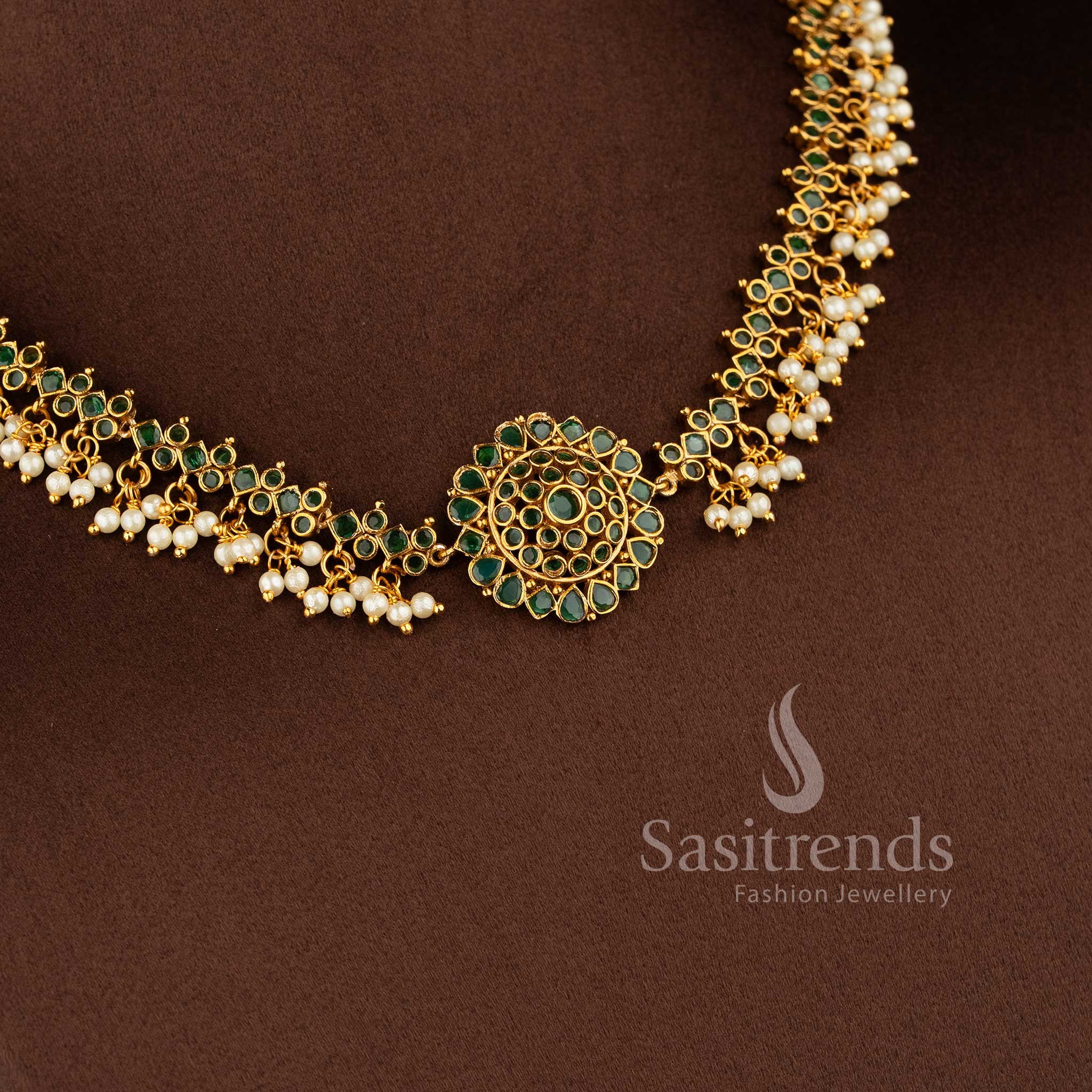 Gorgeous floral pendant temple matte gold plated choker necklace set with AD stones and pearl drops in green by Sasitrends.