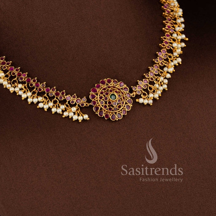 Gorgeous floral pendant temple matte gold plated choker necklace set with AD stones and pearl drops in ruby green by Sasitrends.