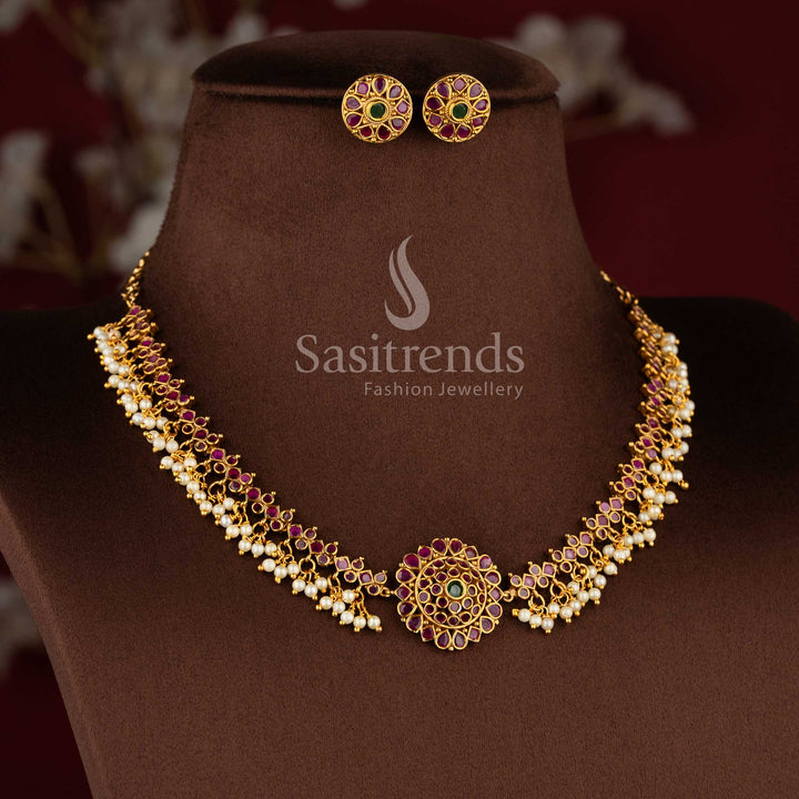 Elegant temple matte gold peacock choker set with ruby and green stones and matching jhumkas.