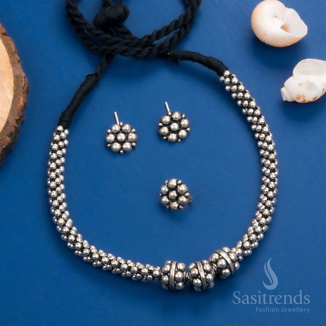 Gorgeous Kolhapuri oxidized silver necklace set with floral earrings and ring, perfect for weddings and festivals - Sasitrends