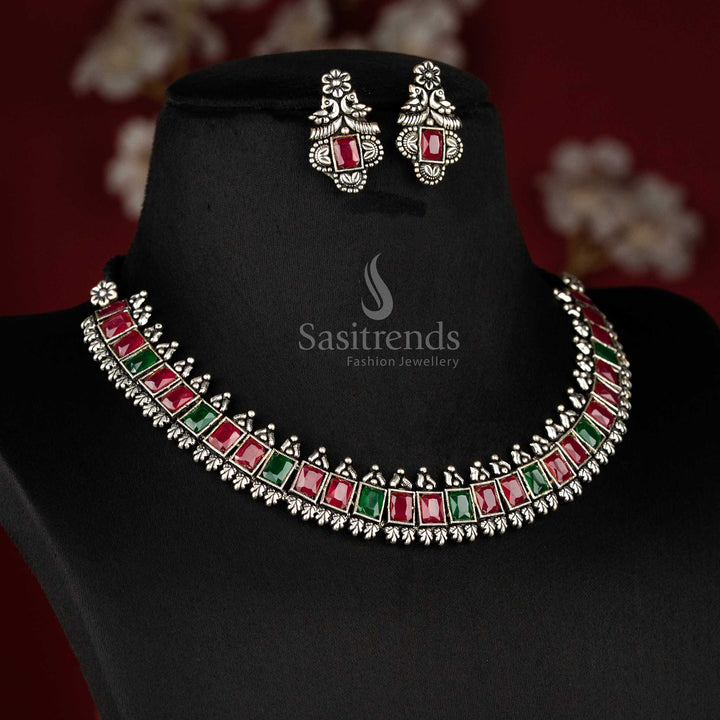 Vintage-inspired oxidised silver jewellery set showcasing deep ruby green rectangular stones and intricate earrings - Sasitrends