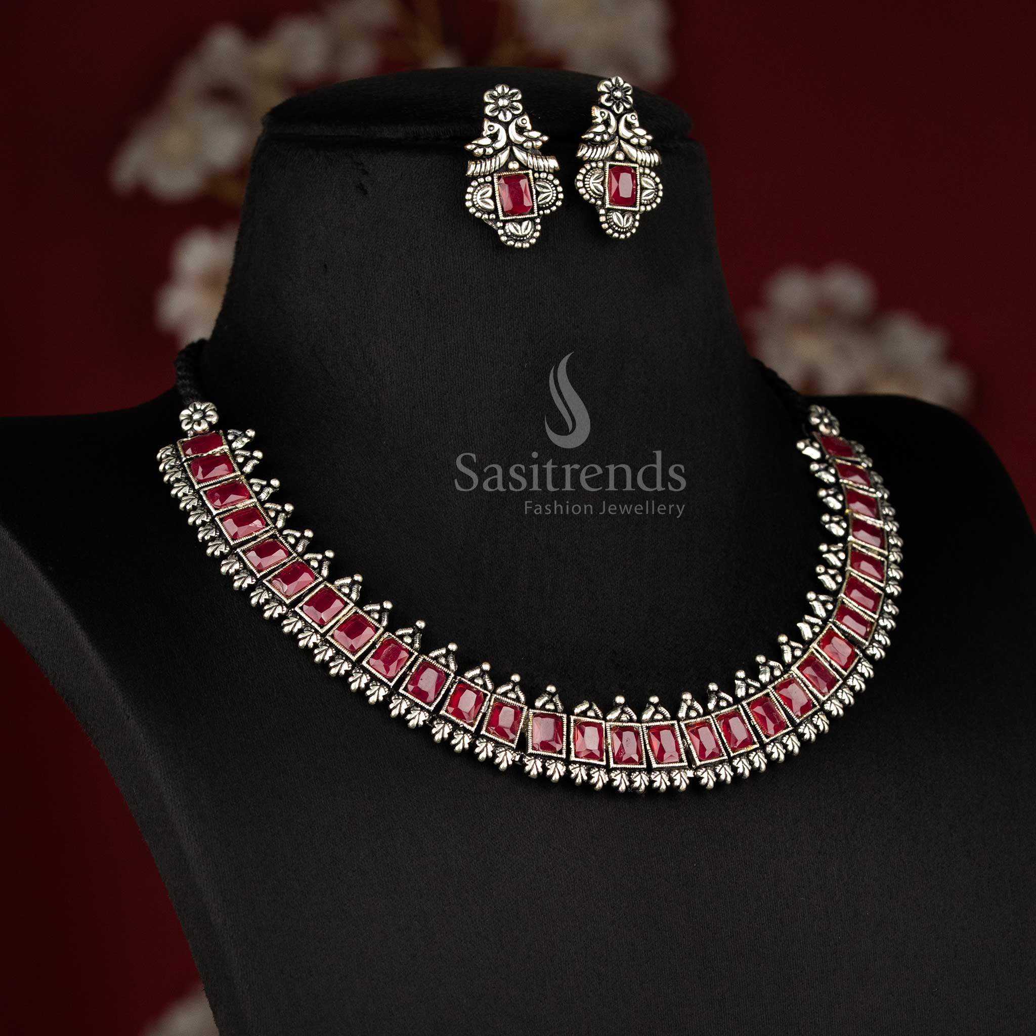 Vintage-inspired oxidised silver jewellery set showcasing deep ruby rectangular stones and intricate earrings - Sasitrends