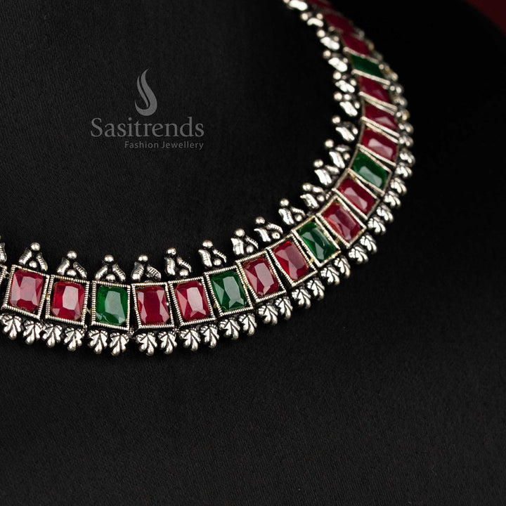 Vintage-inspired oxidised silver jewellery set showcasing deep ruby green rectangular stones and intricate earrings - Sasitrends