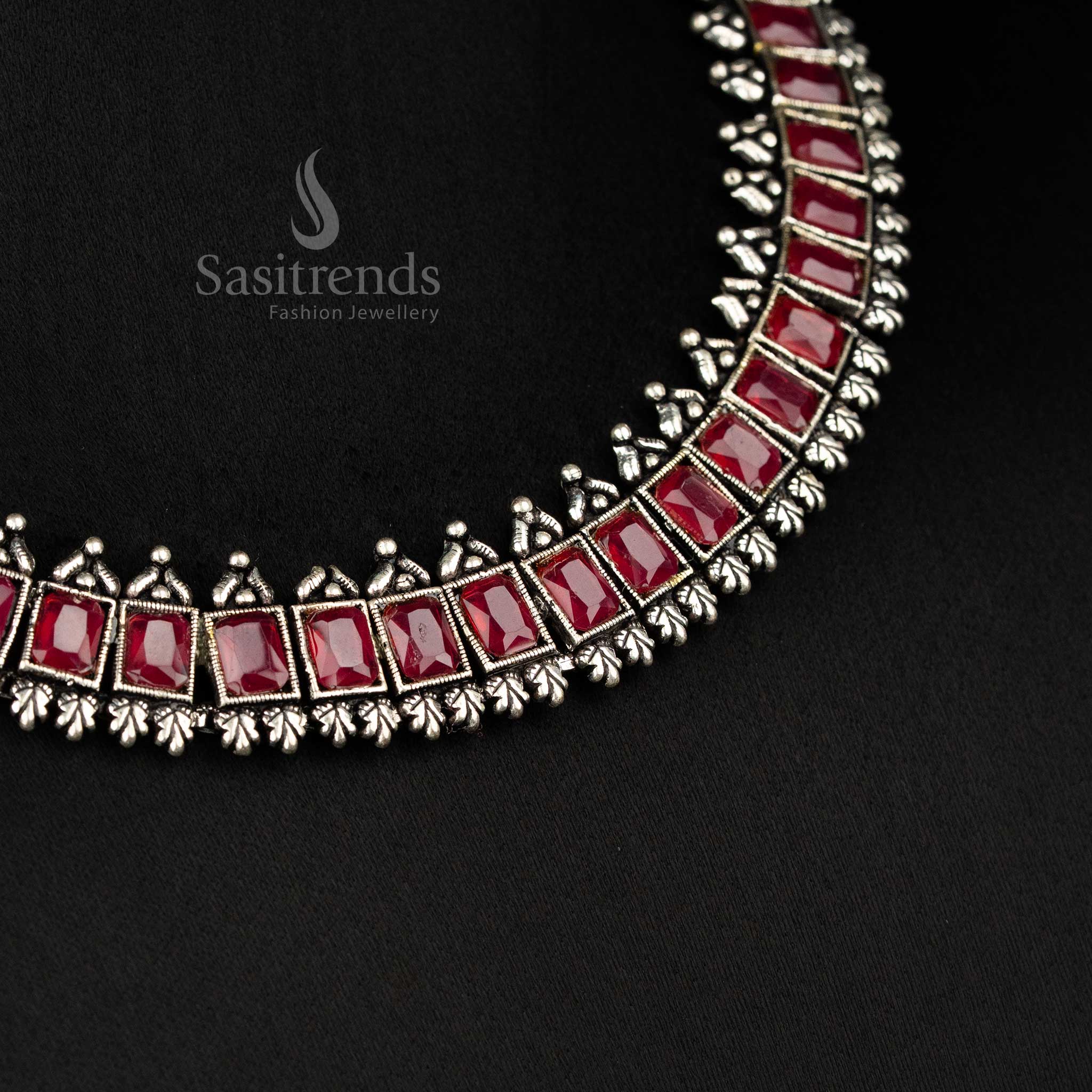 Vintage-inspired oxidised silver jewellery set showcasing deep ruby rectangular stones and intricate earrings - Sasitrends