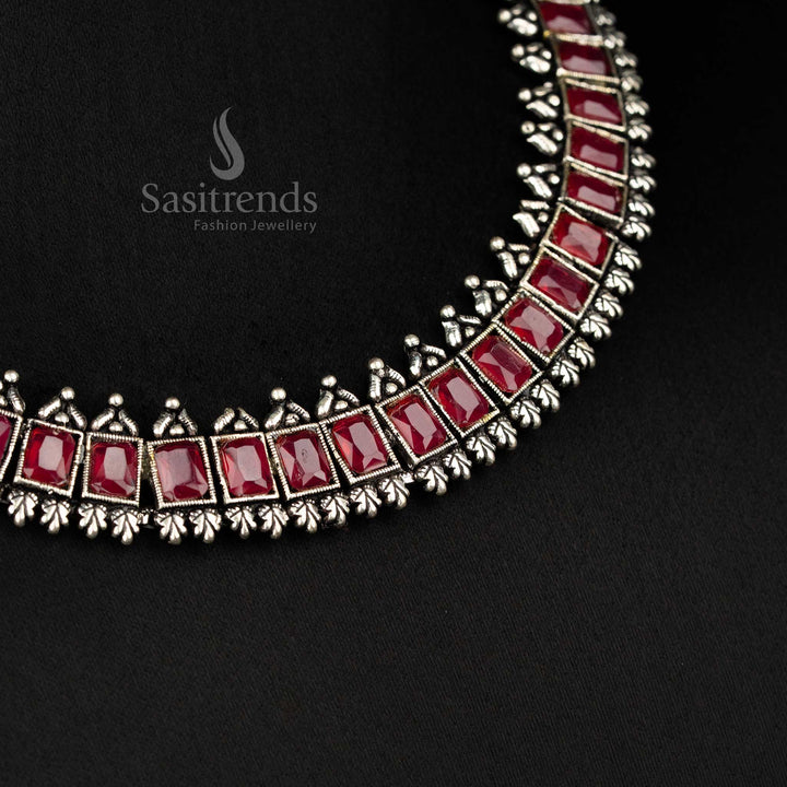 Vintage-inspired oxidised silver jewellery set showcasing deep ruby rectangular stones and intricate earrings - Sasitrends