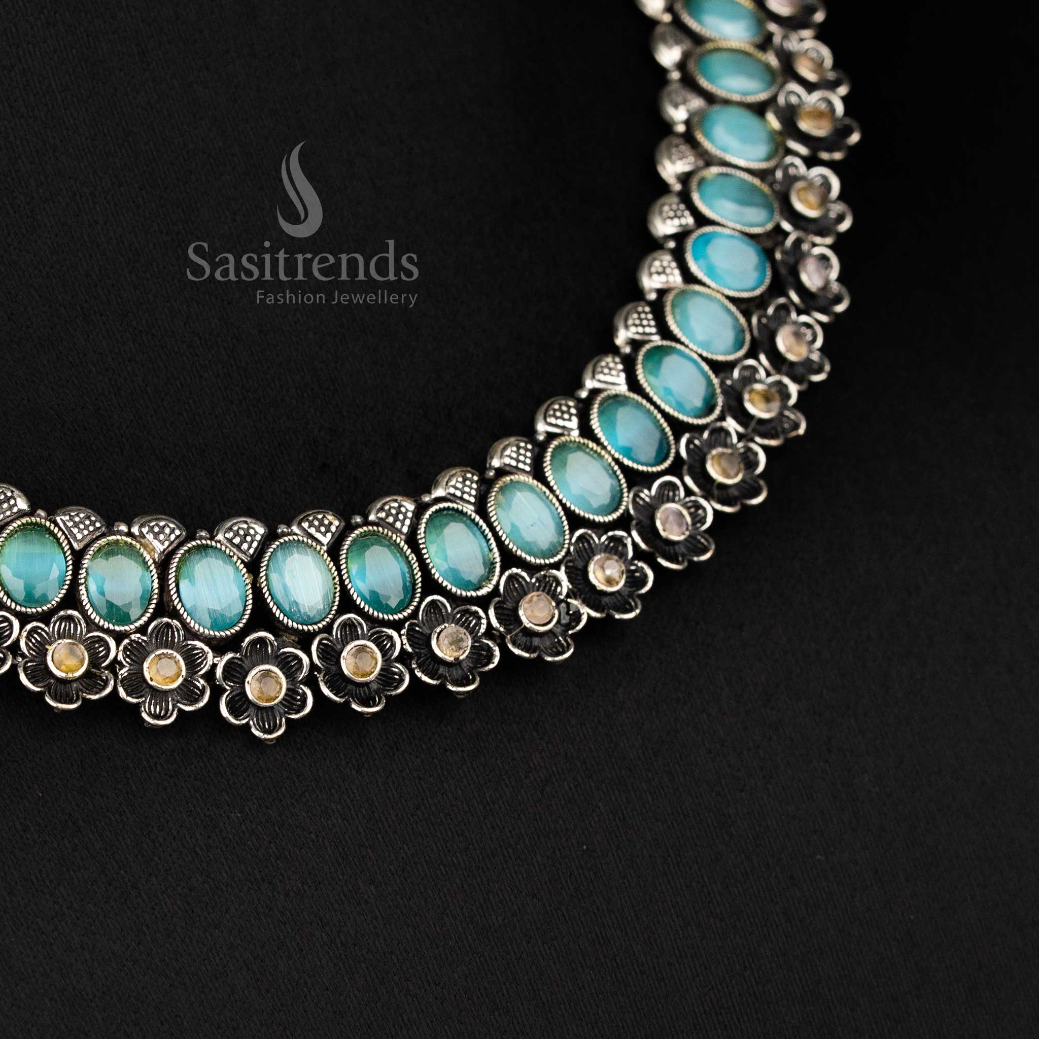 Elegant oxidised floral necklace set featuring mint oval-shaped stones and artistic earrings, offering an exquisite traditional jewellery touch - Sasitrends