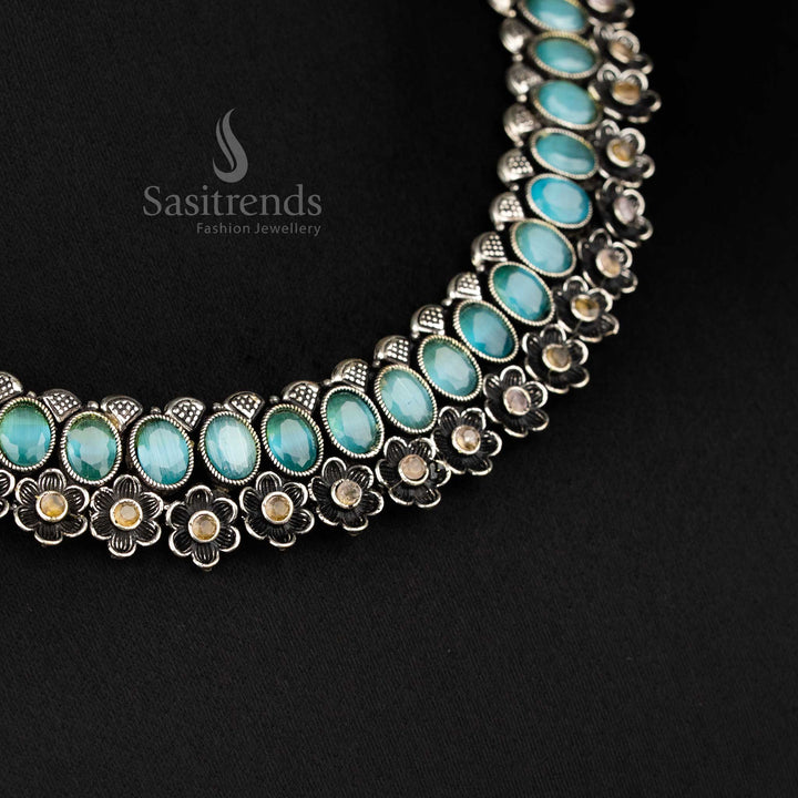 Elegant oxidised floral necklace set featuring mint oval-shaped stones and artistic earrings, offering an exquisite traditional jewellery touch - Sasitrends