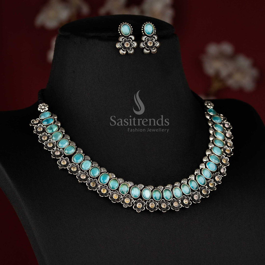 Elegant oxidised floral necklace set featuring mint oval-shaped stones and artistic earrings, offering an exquisite traditional jewellery touch - Sasitrends