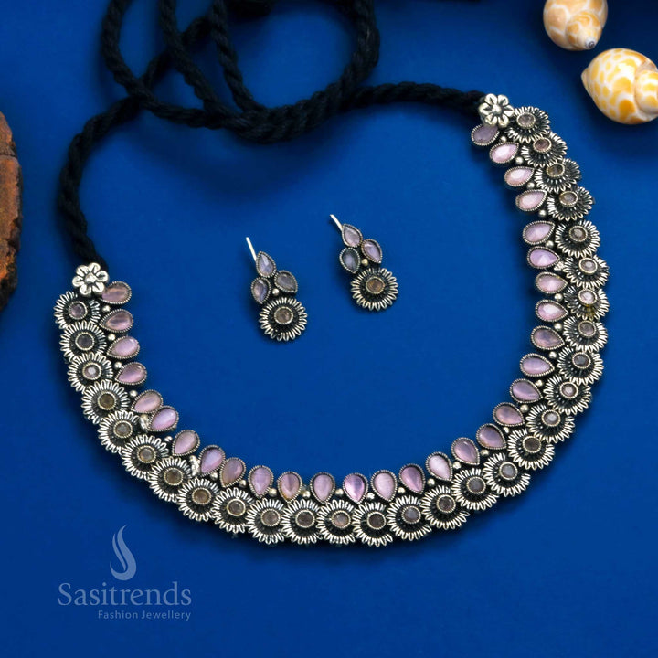 Luxurious handcrafted oxidised floral necklace with deep pink tear drop stones and peacock-inspired earrings - Sasitrends