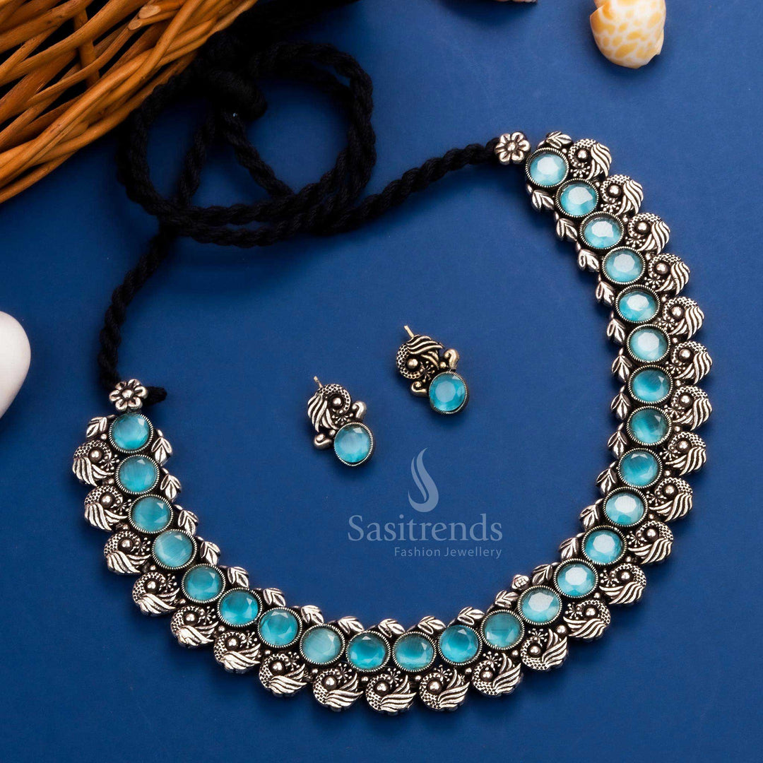 Royal peacock Kushi necklace set in oxidised silver, adorned with sky-blue stones and matching earrings - Sasitrends