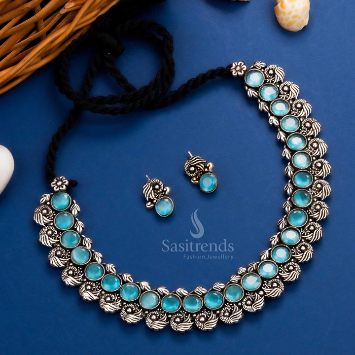 Royal peacock Kushi necklace set in oxidised silver, adorned with sky-blue stones and matching earrings - Sasitrends