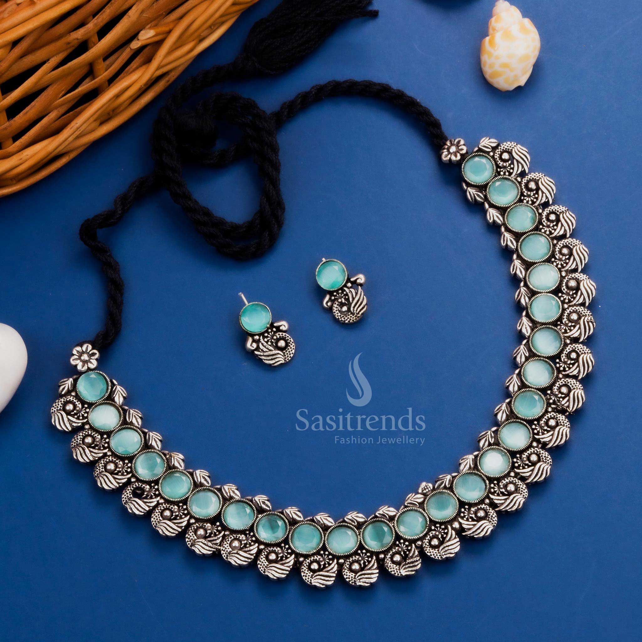 Heritage-inspired peacock Kushi oxidised necklace set featuring elegant mint stones and intricate peacock earrings, a modern ethnic jewellery masterpiece - Sasitrends