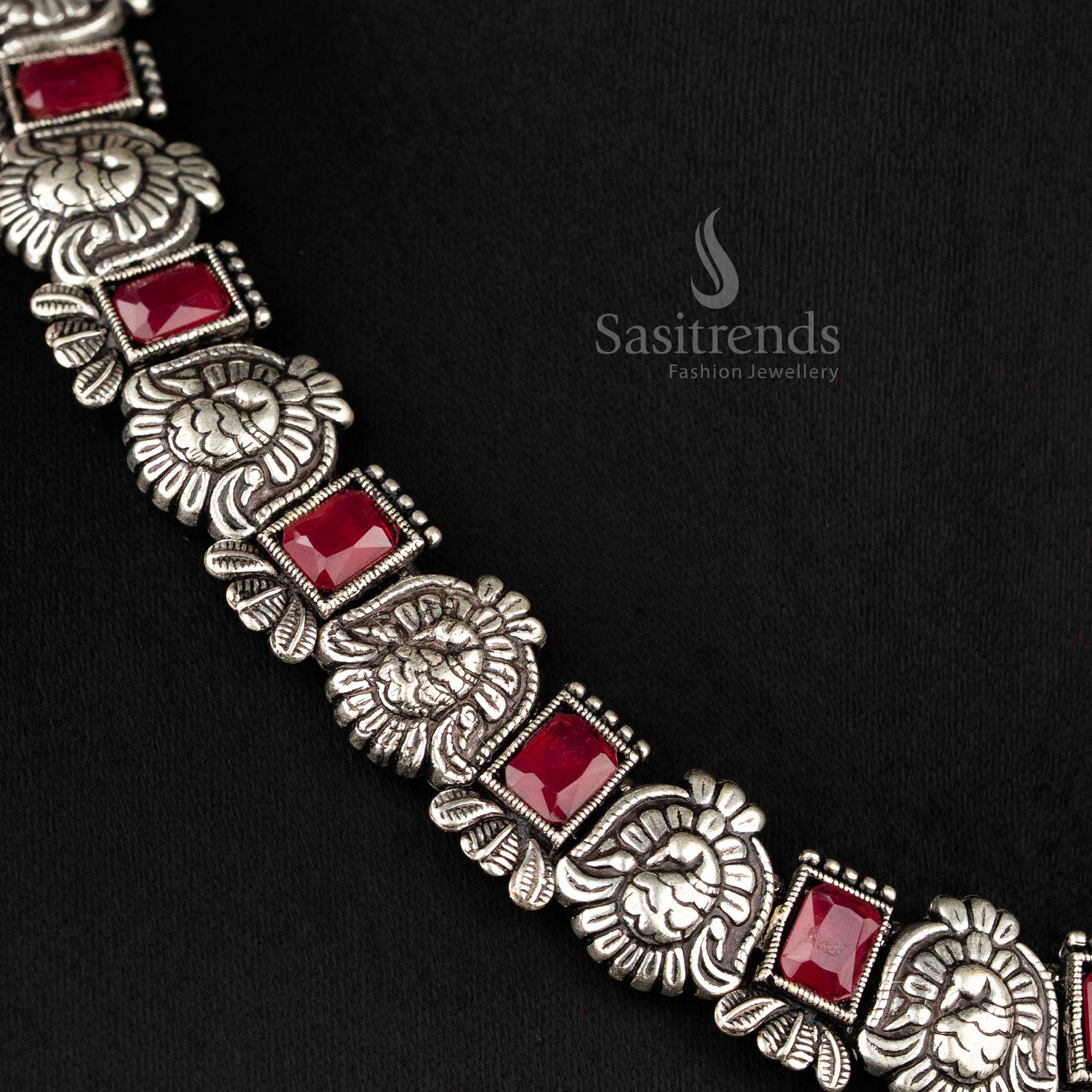 Timeless oxidised peacock Kushi necklace and earrings set featuring glowing ruby stones - Sasitrends 