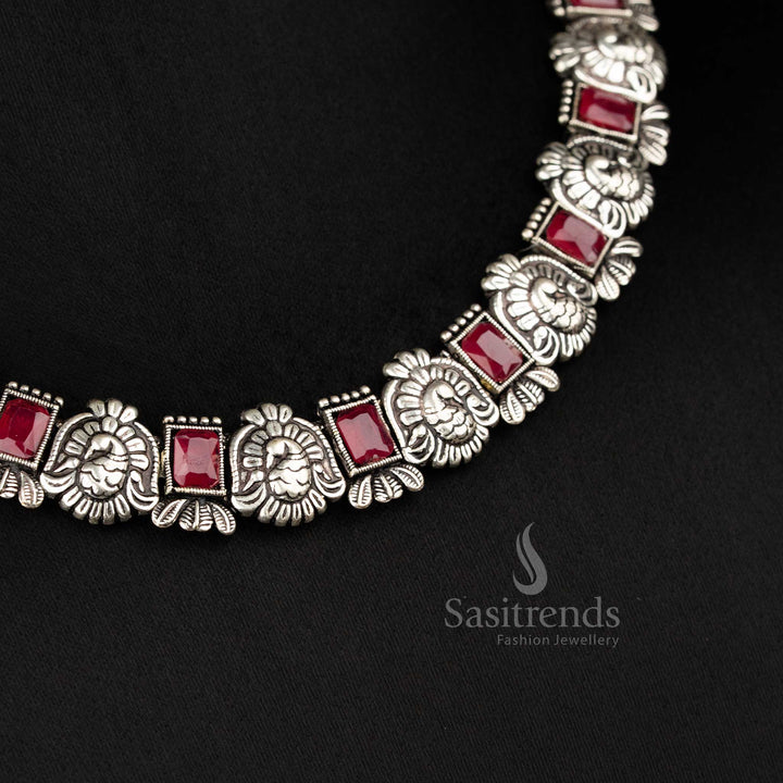 Timeless antique oxidised peacock Kushi necklace and earrings set featuring glowing ruby stones - Sasitrends
