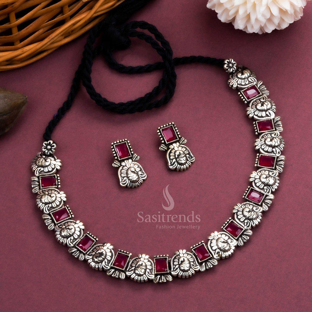 Timeless antique oxidised peacock Kushi necklace and earrings set featuring glowing ruby stones - Sasitrends