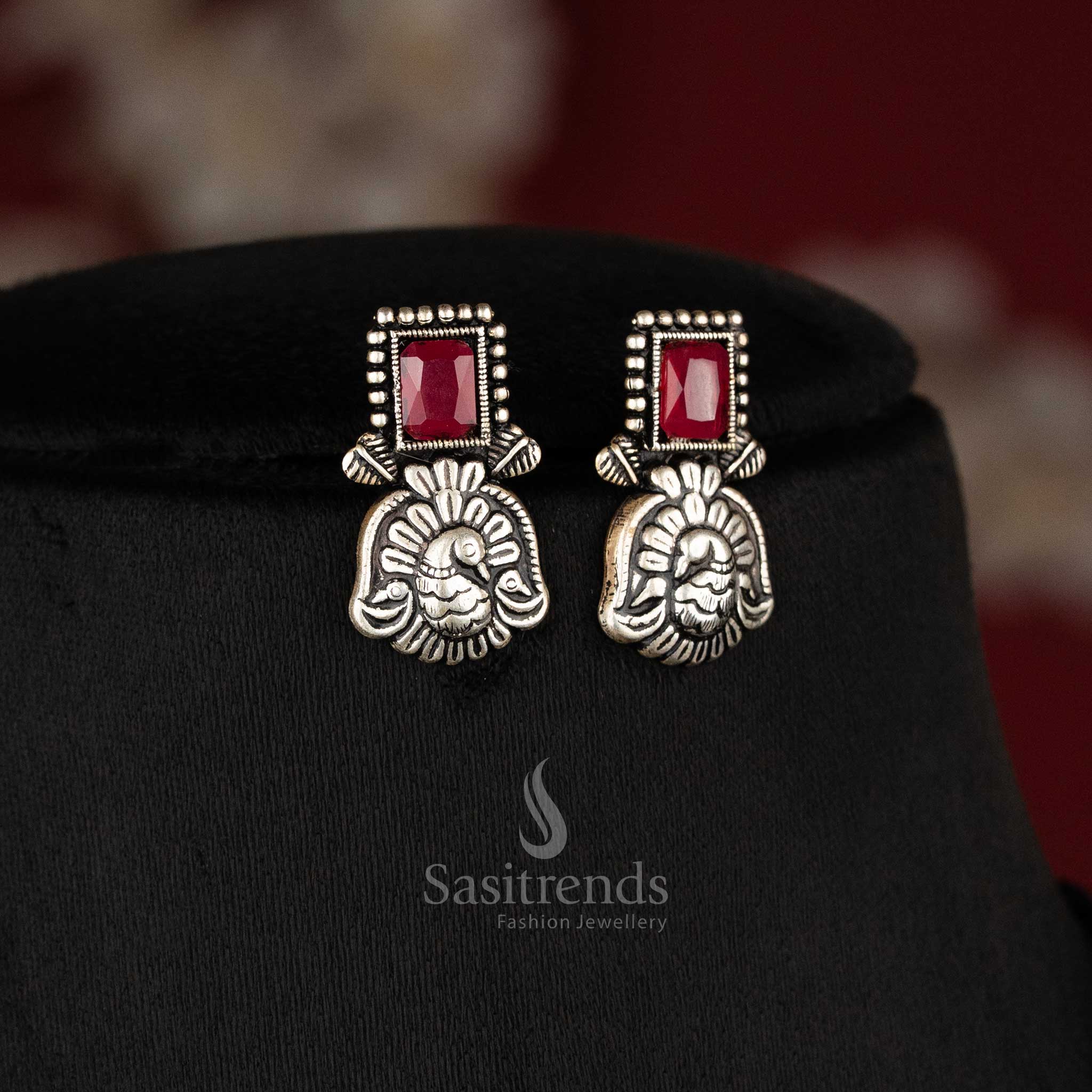 Timeless antique oxidised peacock Kushi necklace and earrings set featuring glowing ruby stones - Sasitrends