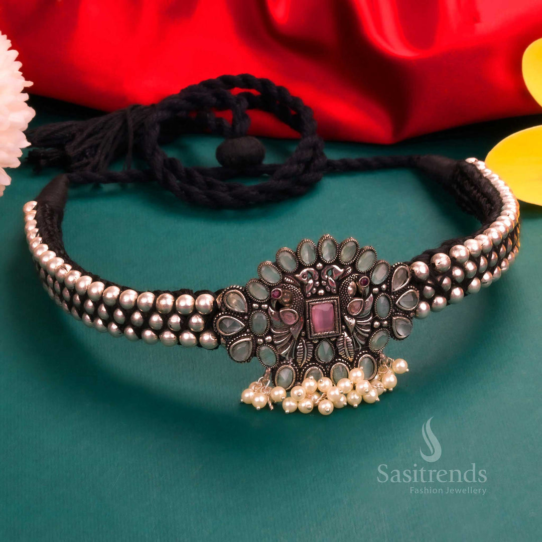 Heritage-style Kolhapuri oxidised choker necklace with a mint and pink floral pendant, designed with a pearl-adorned layered structure for a majestic ethnic look - Sasitrends