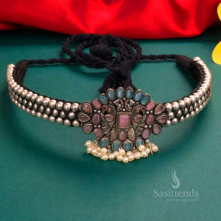 Royal oxidised Kolhapuri choker necklace with a brilliant blue and pink floral pendant, enhanced with pearl beads - Sasitrends