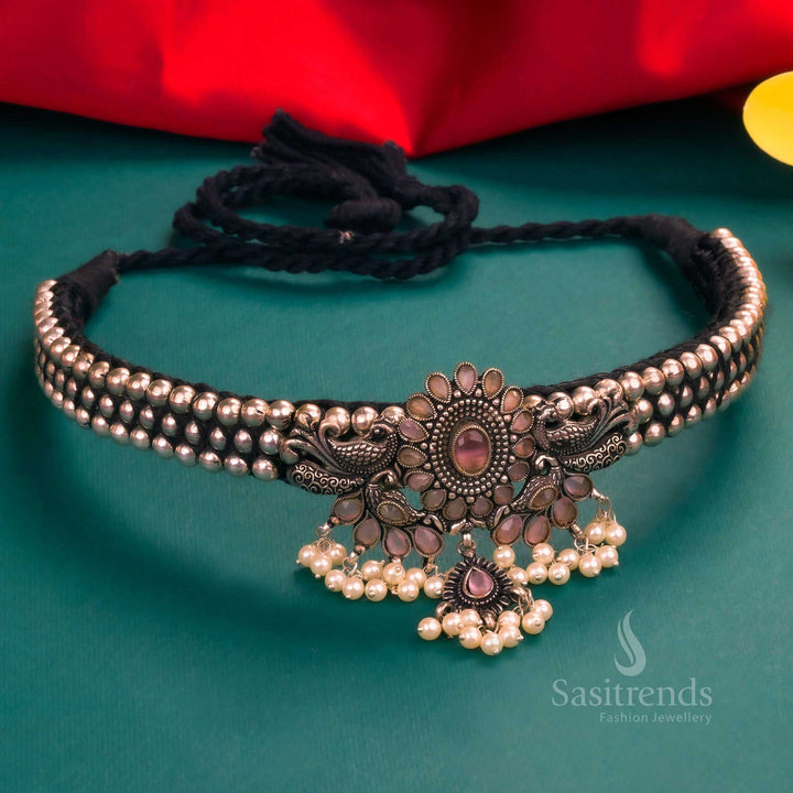 Royal Kolhapuri oxidised peacock pendant choker featuring pink stones and a pearl-adorned design, a perfect addition to Navarathiri special jewellery collections - Sasitrends