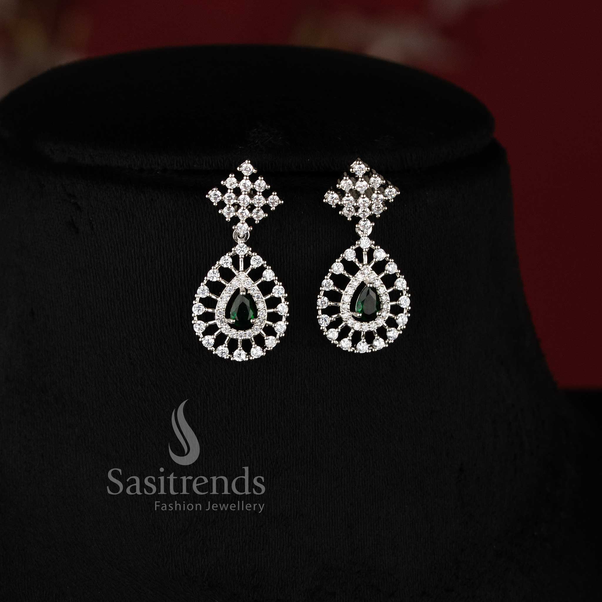 Party Wear American Diamond Necklace Jewellery Set featuring Rhodium Silver Plated Thilak Pendant with green Stone Accents - Sasitrends