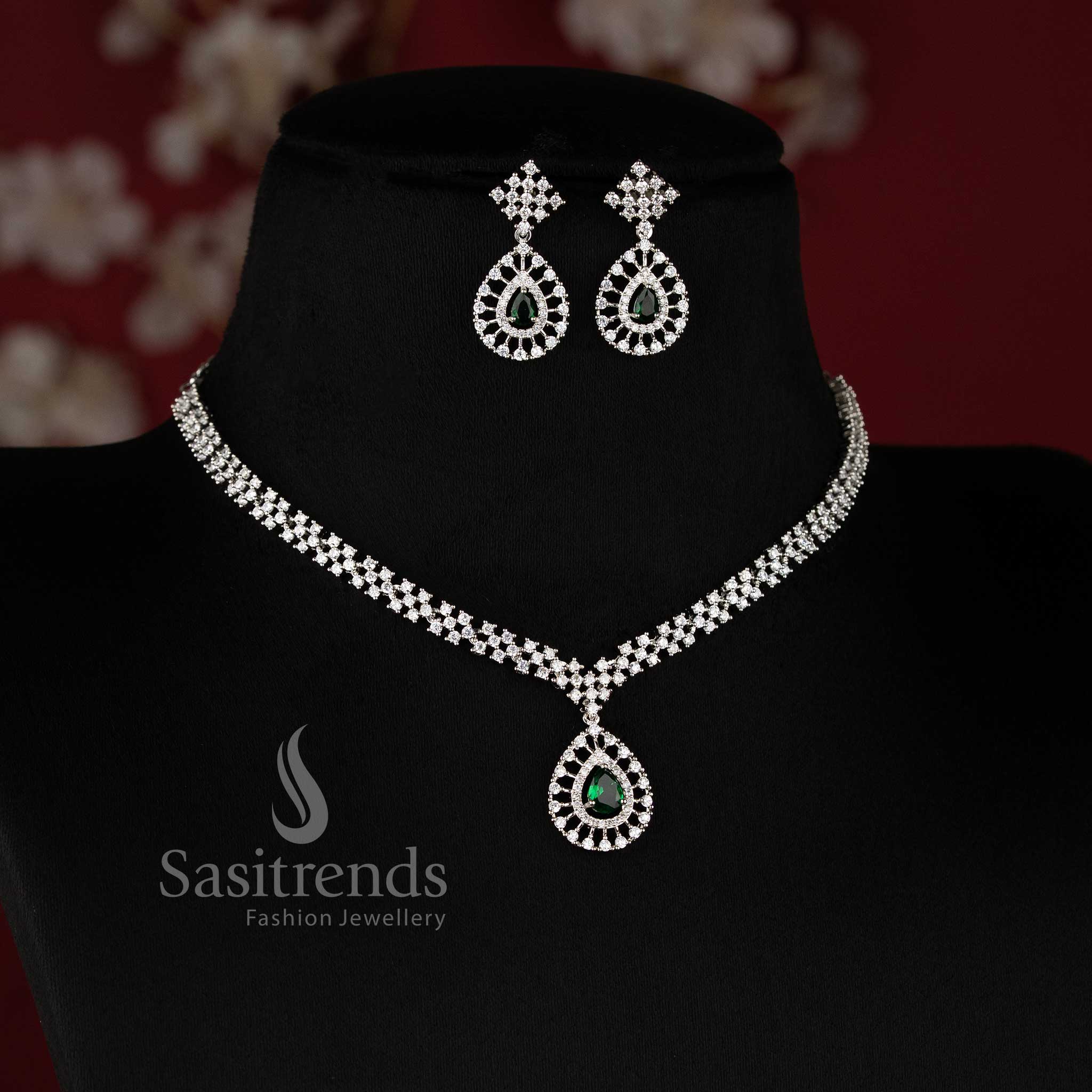 Party Wear American Diamond Necklace Jewellery Set featuring Rhodium Silver Plated Thilak Pendant with green Stone Accents - Sasitrends