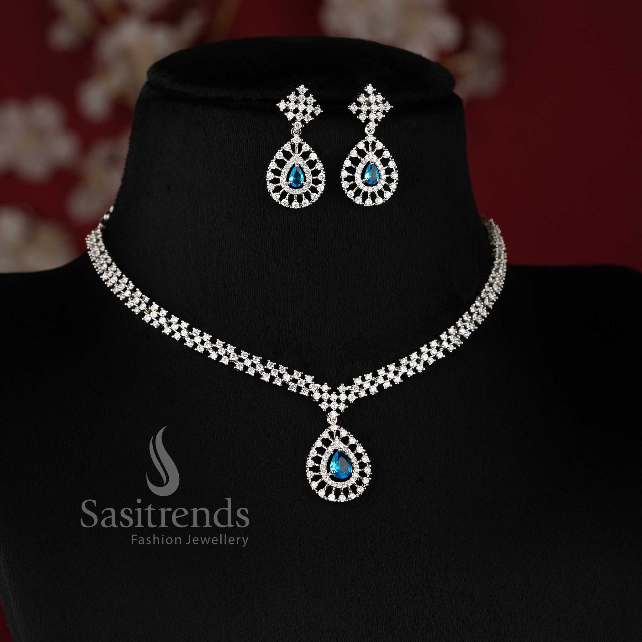Rich Look American Diamond Necklace Set with Aqua Blue Stone Thilak Pendant and Rhodium Silver Plated Finish - Sasitrends