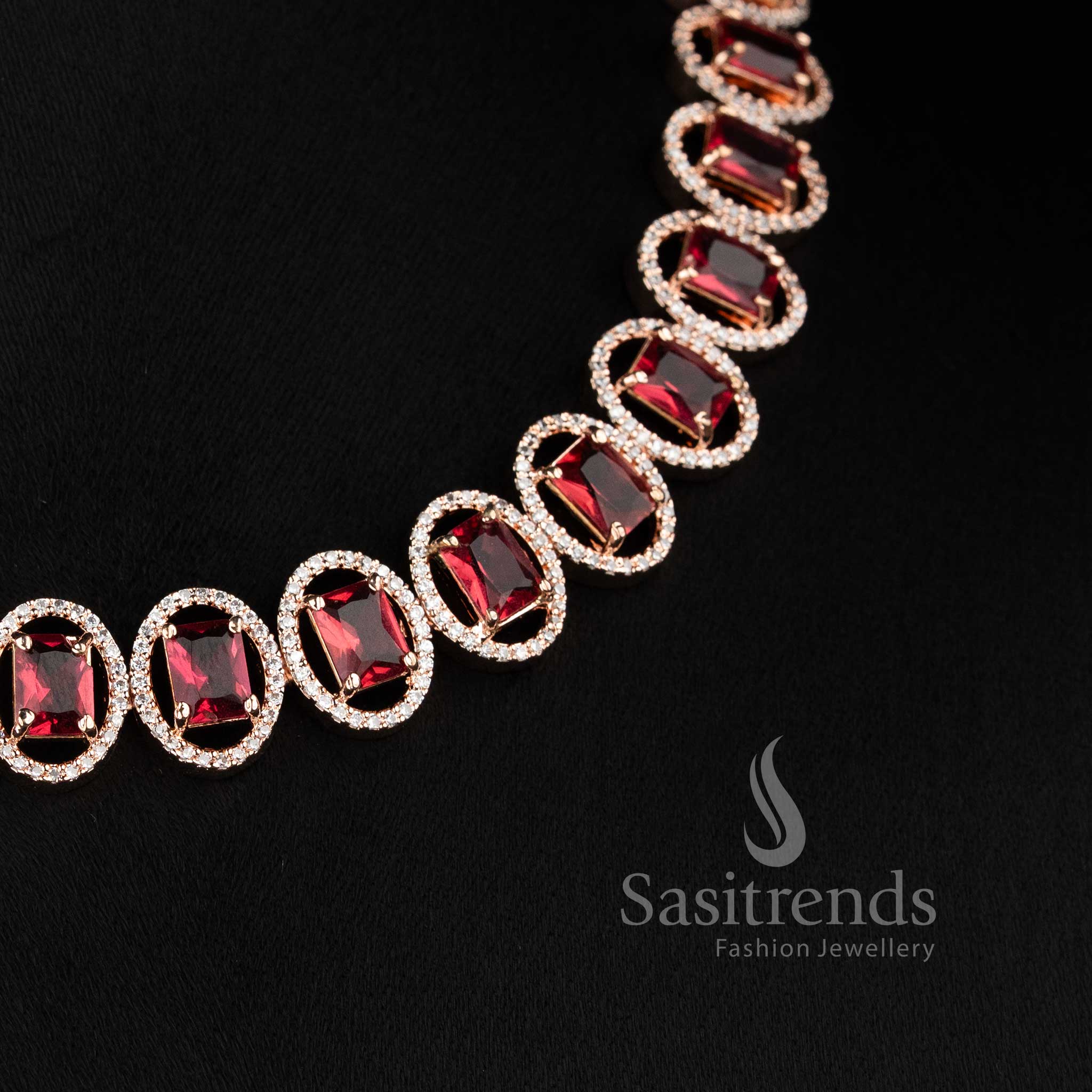 Stylish rose gold plated necklace jewellery set with sparkling red American Diamonds.