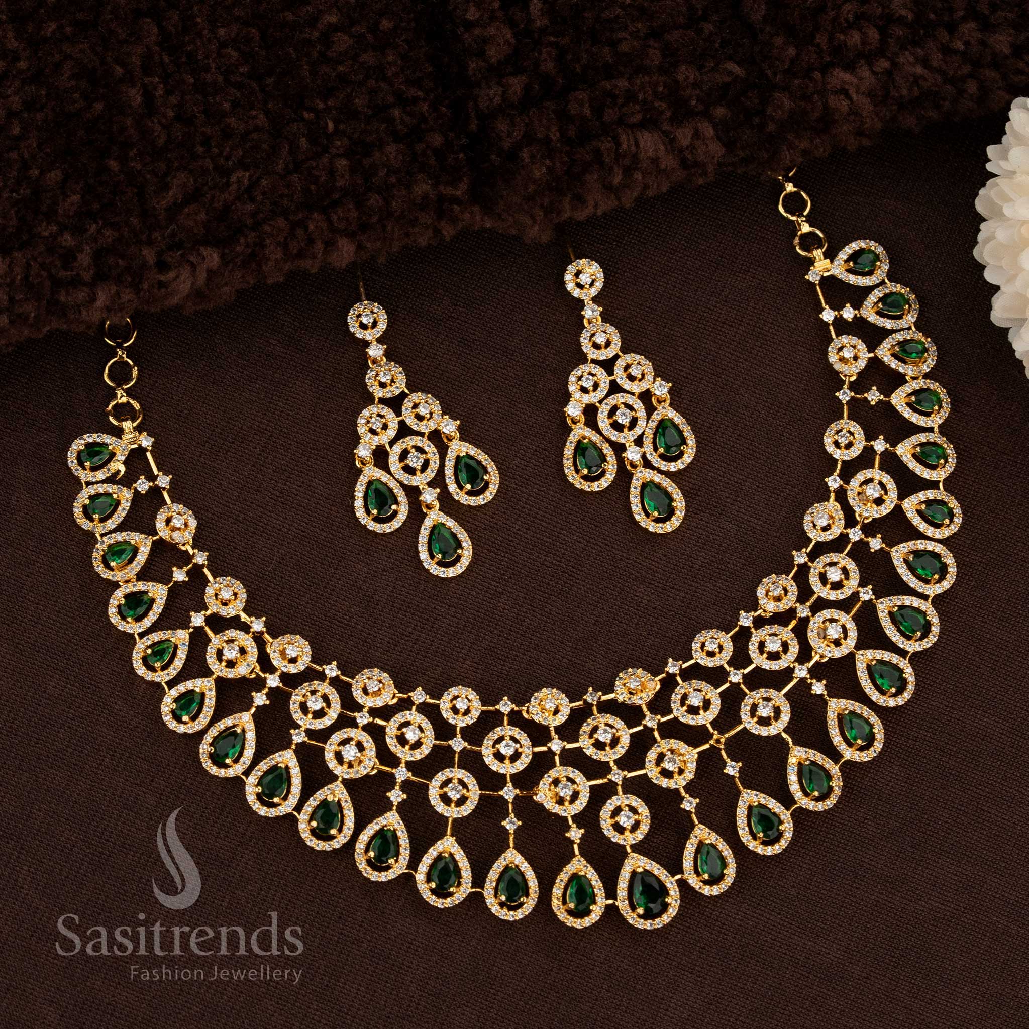 Elegant Floral American Diamond Choker Gold Plated Necklace Set With Teardrop Design And Pearl Drops In Lush Green Tone For Bridal Occasions, Festivals, And Saree Styling – Sasitrends