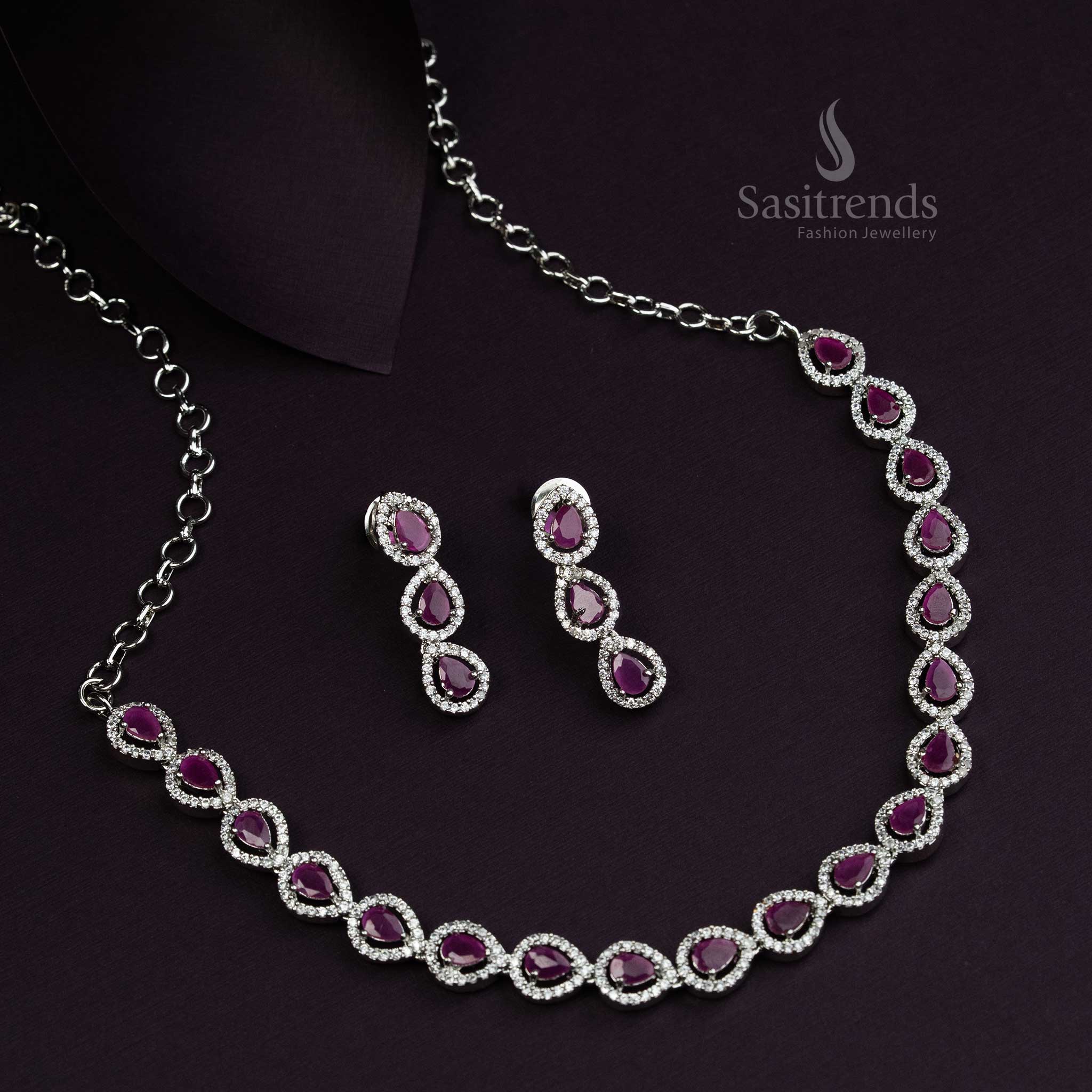 Gorgeous Thilak pattern rhodium silver plated jewellery set with rich ruby American Diamond stones, an exquisite festive wear accessory for traditional celebrations - Sasitrends