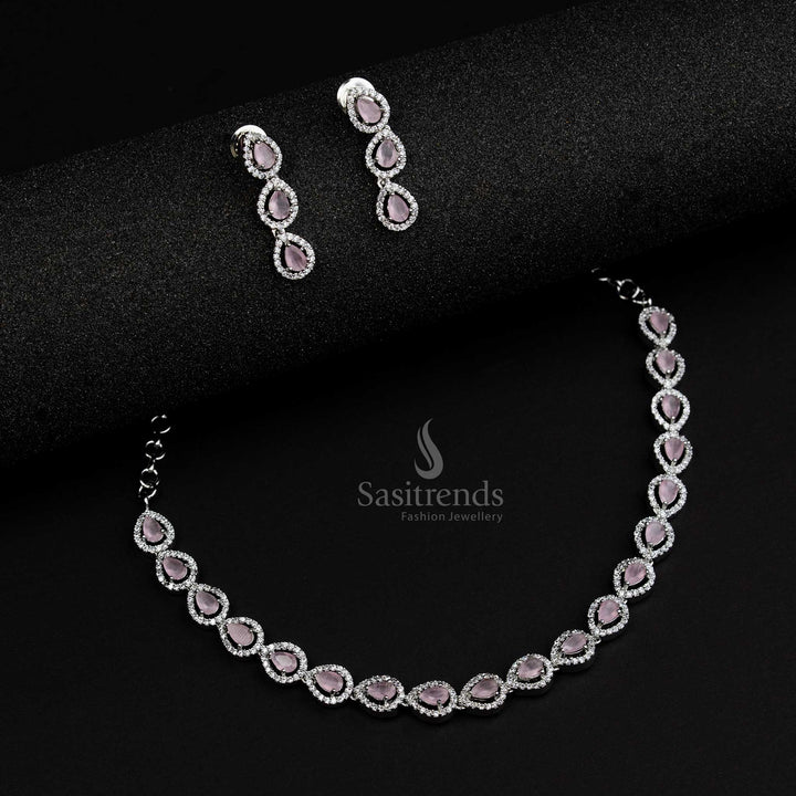 Chic rhodium silver plated jewellery set with pink stones in an artistic Thilak pattern, a feminine style statement for modern jewellery collections - Sasitrends

