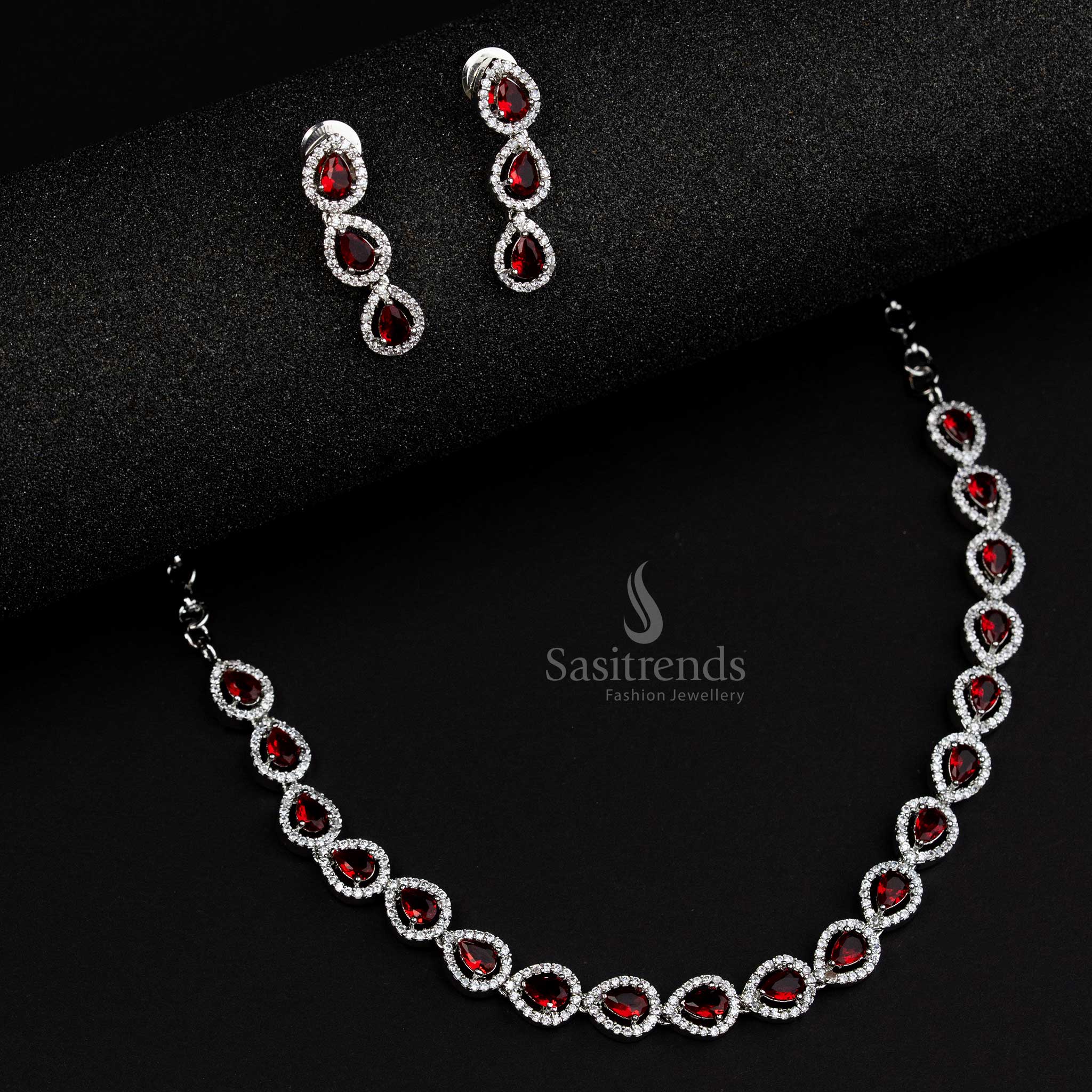 Vibrant red American Diamond jewellery set in Thilak pattern with rhodium silver plating, a festive statement piece for weddings and celebrations - Sasitrends