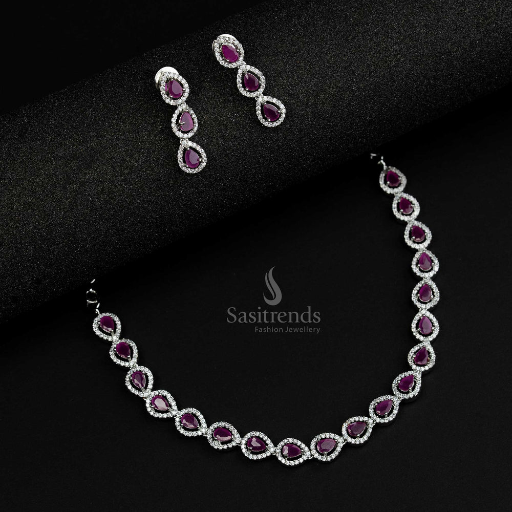 Charming rhodium silver plated jewellery set featuring ruby American Diamond stones and a detailed Thilak design, an ethnic statement piece for women - Sasitrends

