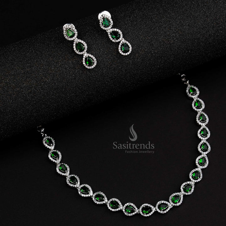 Elegant green American Diamond Thilak pattern jewellery set in rhodium silver plating, a stunning party wear design crafted for timeless sophistication - Sasitrends