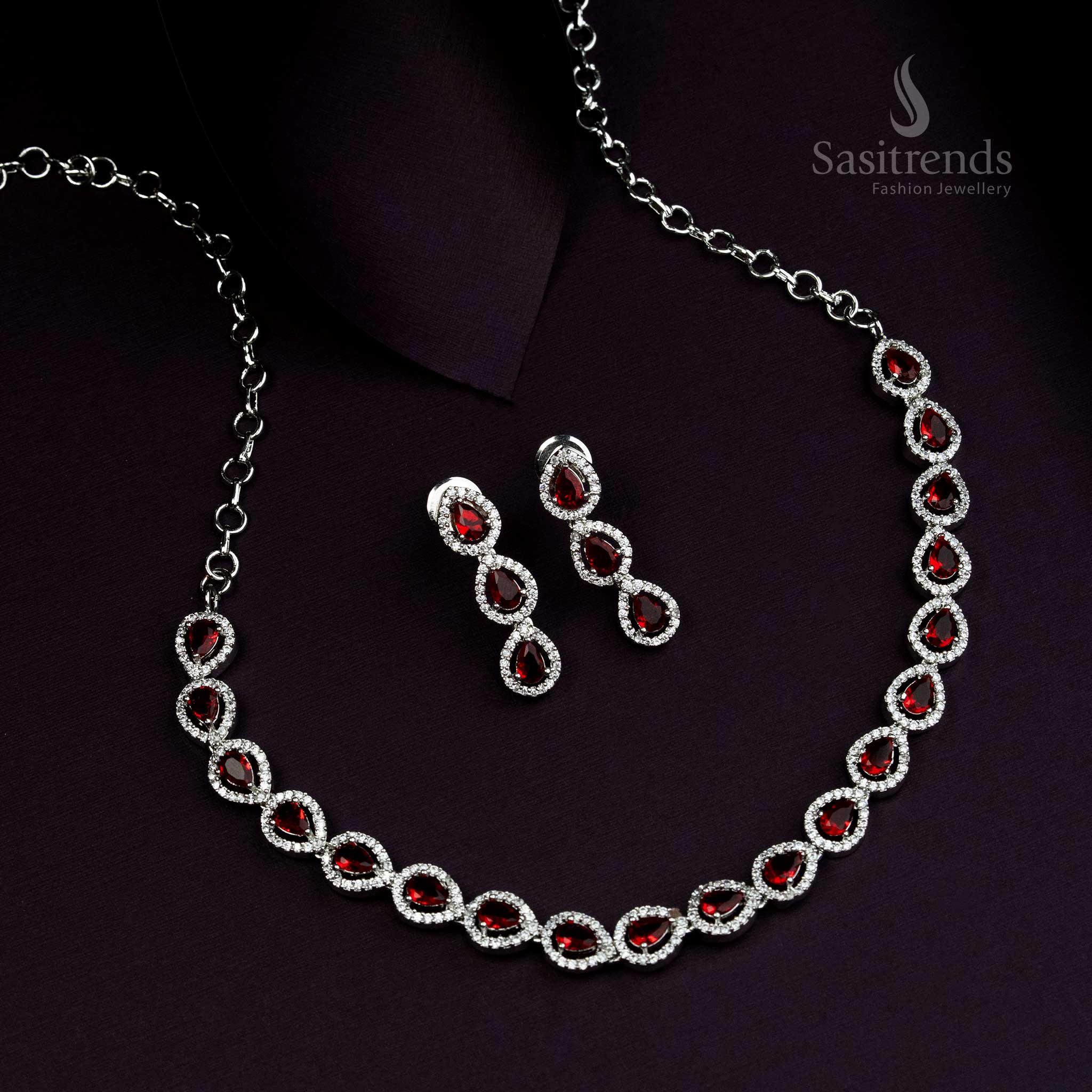 Vibrant rhodium silver plated jewellery set with glowing red stones and Thilak design, traditional luxury jewellery for grand ethnic occasions - Sasitrends

