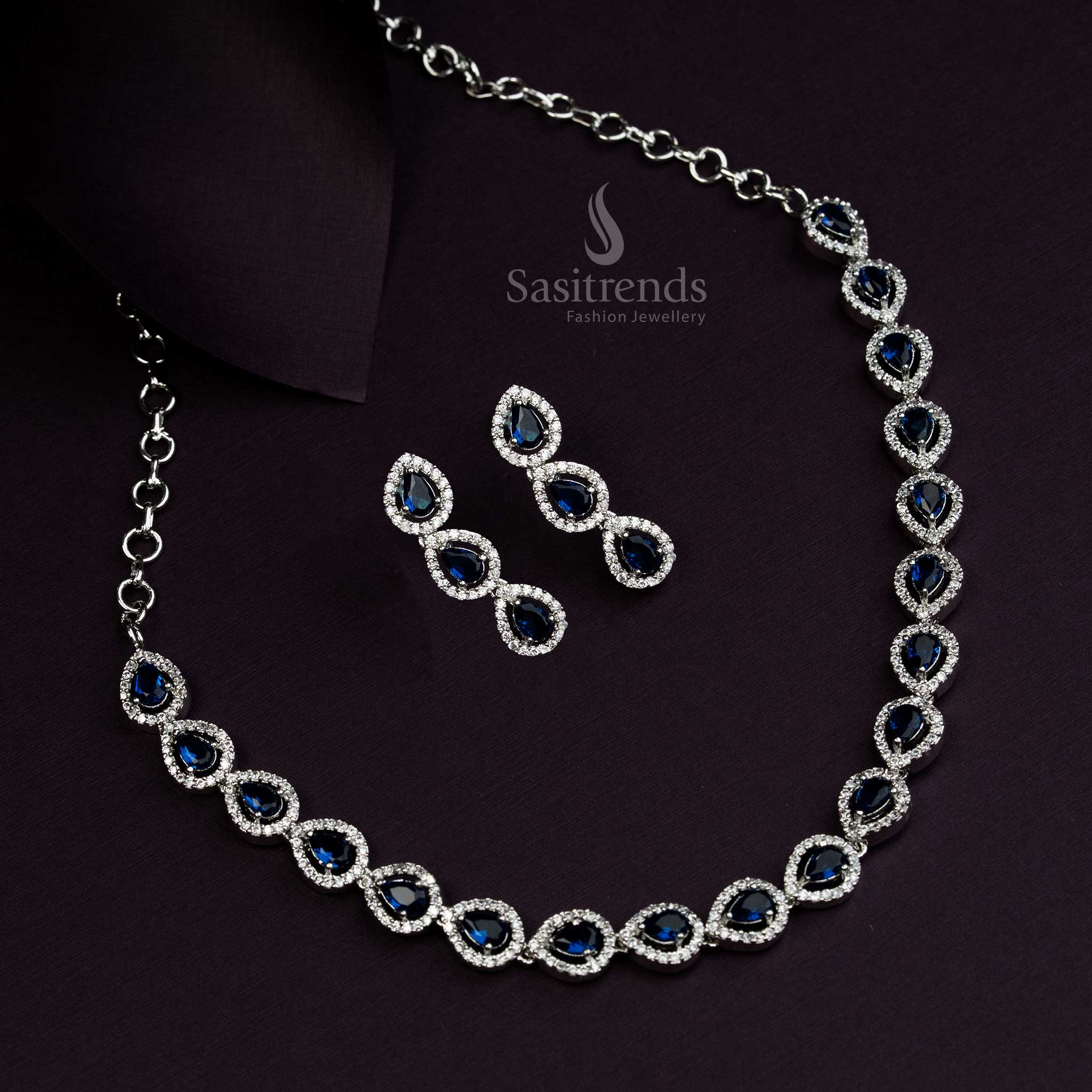 Elegant blue American Diamond jewellery set in rhodium silver plating with a luxurious Thilak pattern design, ideal for glamorous evening parties - Sasitrends

