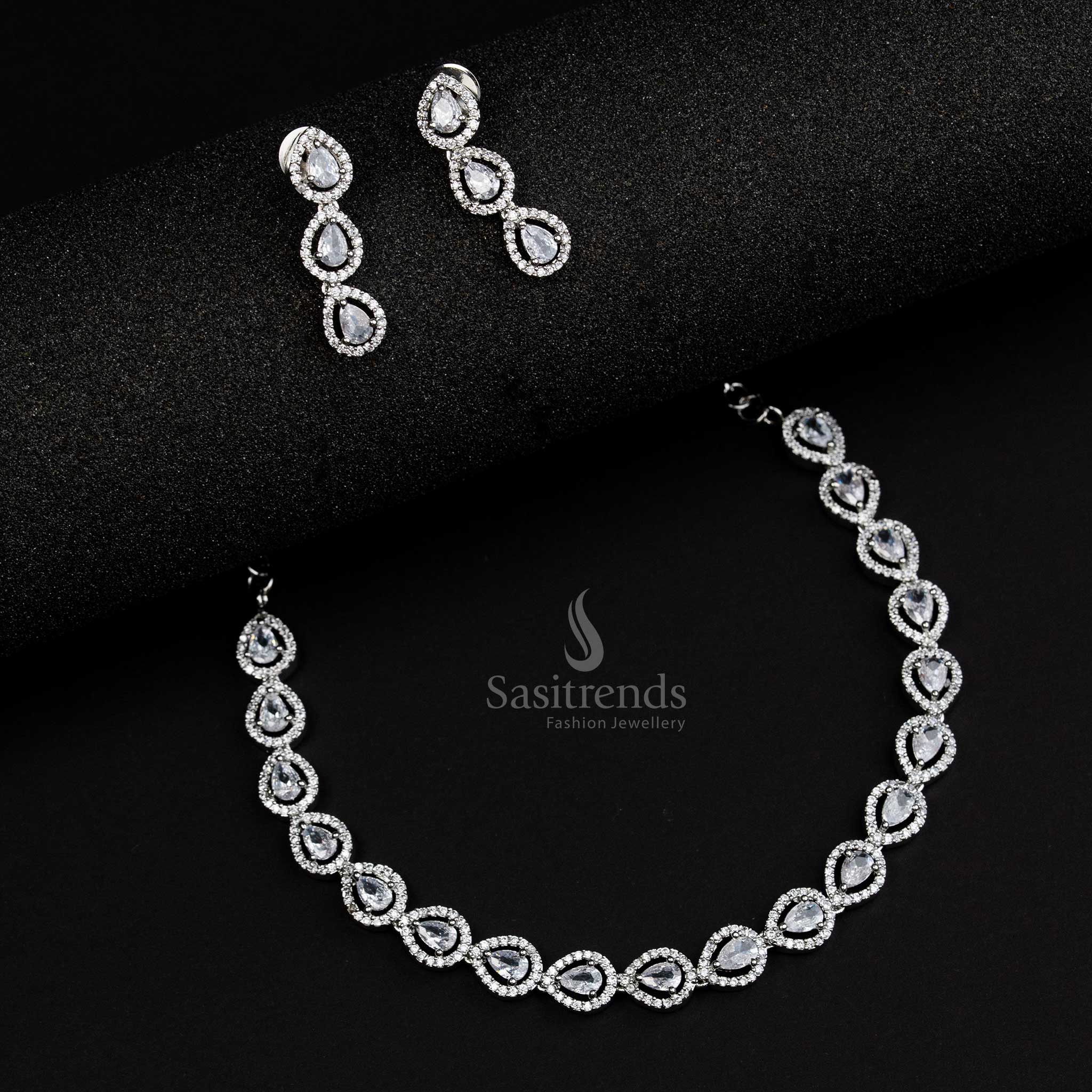 Rhodium silver plated jewellery set with white American Diamond stones in an intricate Thilak pattern, perfect for modern fusion style jewellery collections - Sasitrends