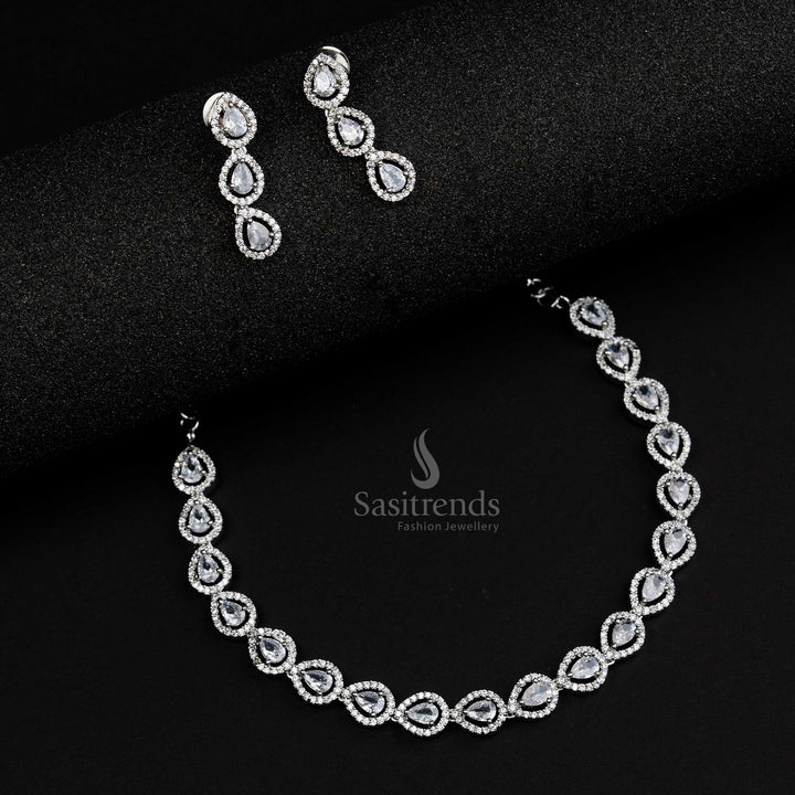 Rhodium silver plated jewellery set with white American Diamond stones in an intricate Thilak pattern, perfect for modern fusion style jewellery collections - Sasitrends