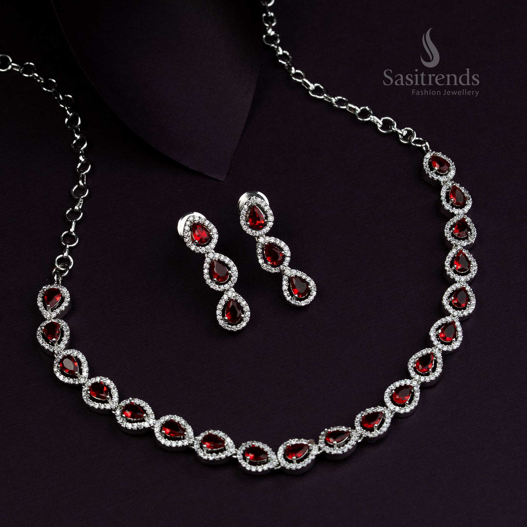 Elegant rhodium silver plated jewellery set with glowing red stones and Thilak design, traditional luxury jewellery for grand ethnic occasions - Sasitrends