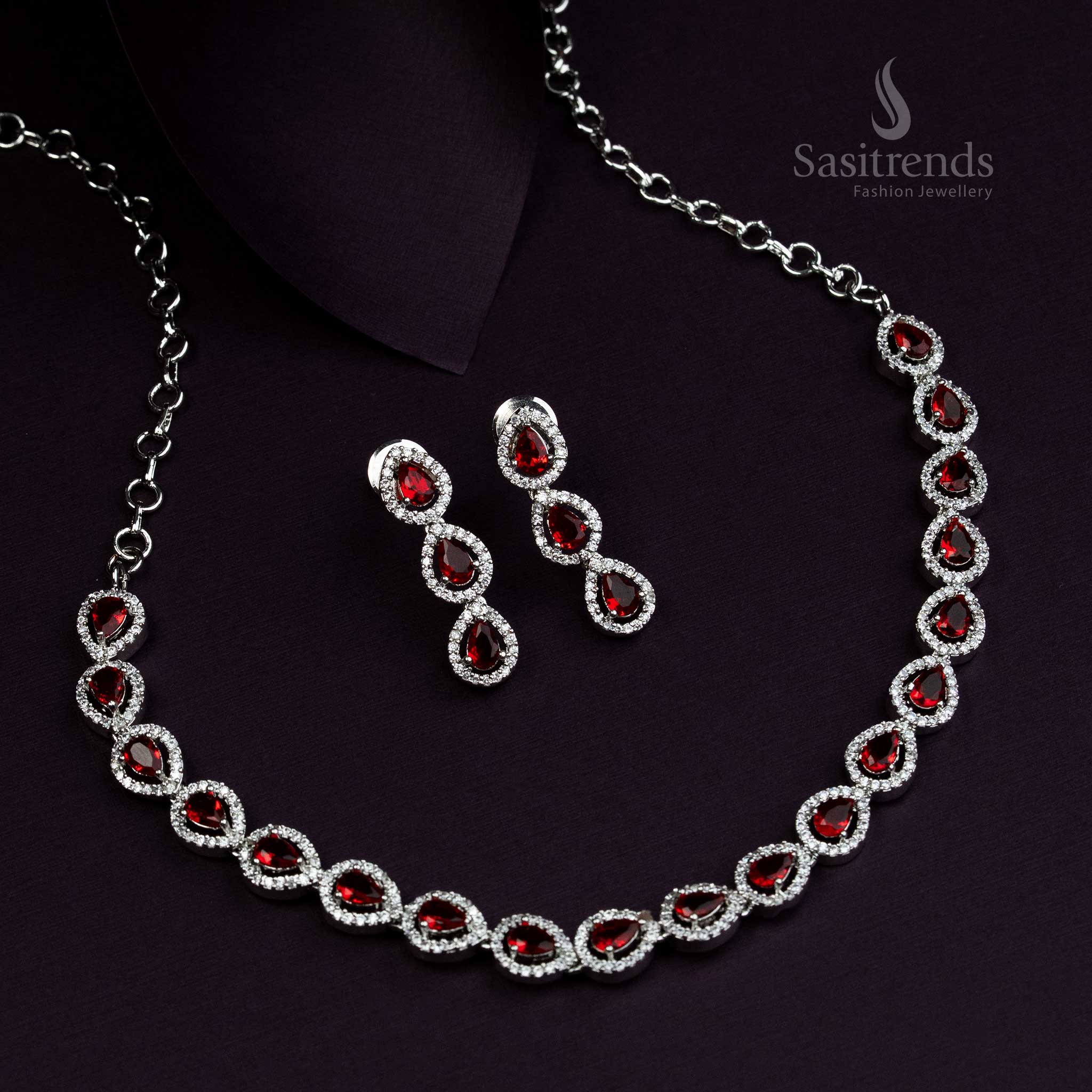 Elegant rhodium silver plated jewellery set with glowing red stones and Thilak design, traditional luxury jewellery for grand ethnic occasions - Sasitrends
