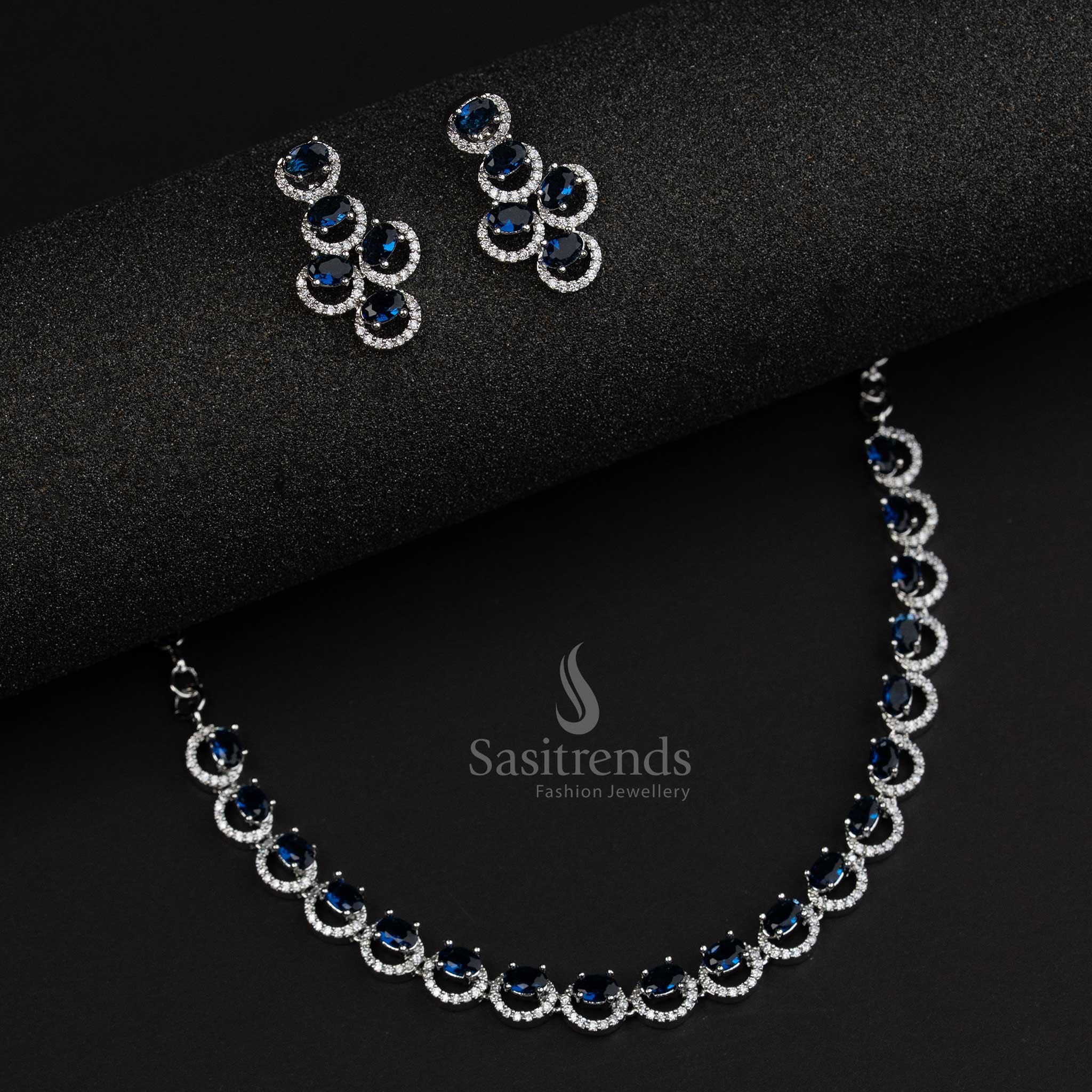 Blue party wear jewellery set in rhodium silver with oval American diamond stones and a modern festive touch – Sasitrends