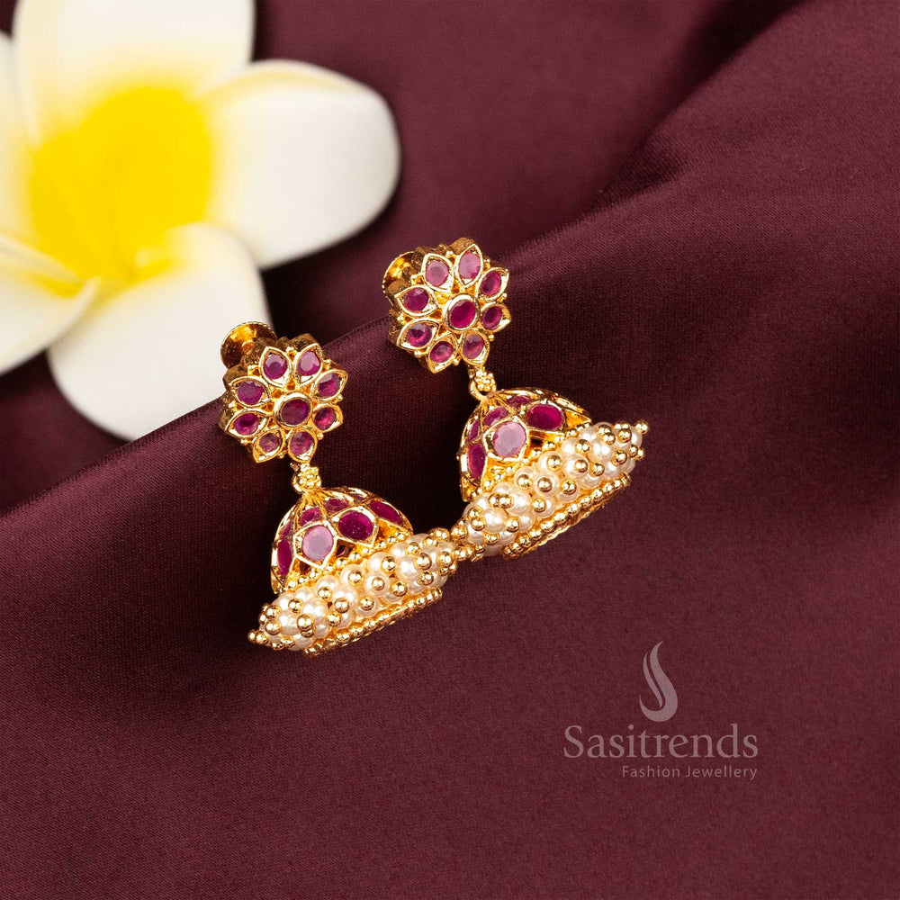 Bold ruby-toned ethnic earrings featuring micro gold polish, delicate pearl drops and detailed AD stone finish – great for weddings and traditions – Sasitrends