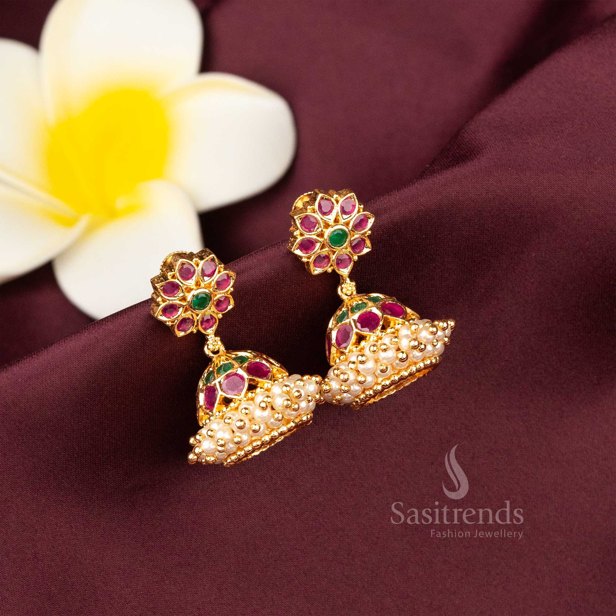 https://chatgpt.com/c/68467c30-0aa0-8012-81f4-9a643186b17a#:~:text=Glamorous%20ruby%2Dgreen%20earrings%20in%20traditional%20temple%20style%2C%20embellished%20with%20pearl%20drops%20and%20American%20diamond%20sparkle%20%E2%80%93%20Sasitrends