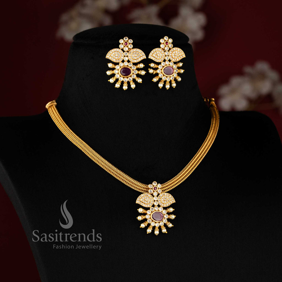 Classic temple matte gold choker jewellery set featuring a white and ruby floral pendant, designed for traditional functions and bridal glamour – Sasitrends