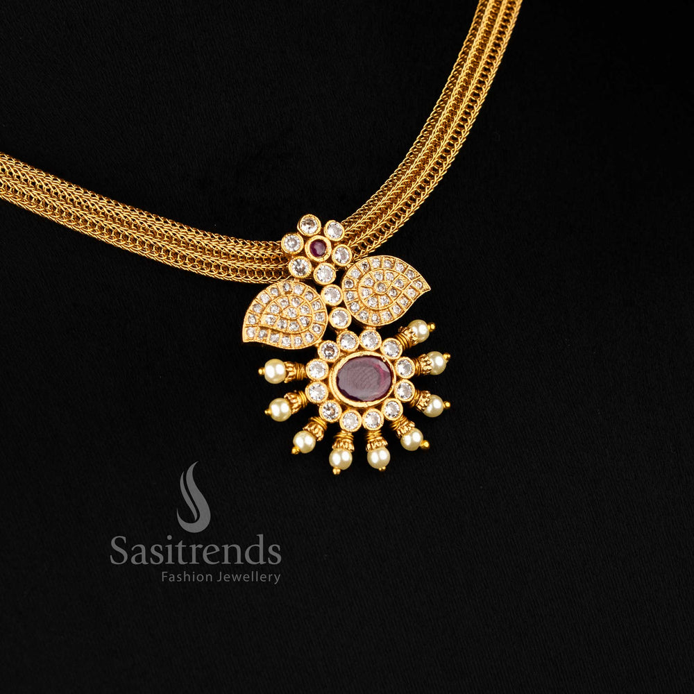 Classic temple matte gold choker jewellery set featuring a white and ruby floral pendant, designed for traditional functions and bridal glamour – Sasitrends