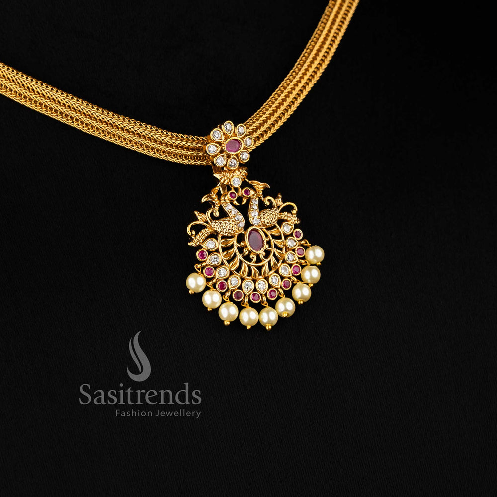 Divine White Ruby Stone Temple Gold Peacock Pendant Jewellery Set With Matte Finish And Cultural Flair – A Celebratory Look Combining Heritage Styling With Charming Ruby Accents And Spiritual Peacock Design – Sasitrends