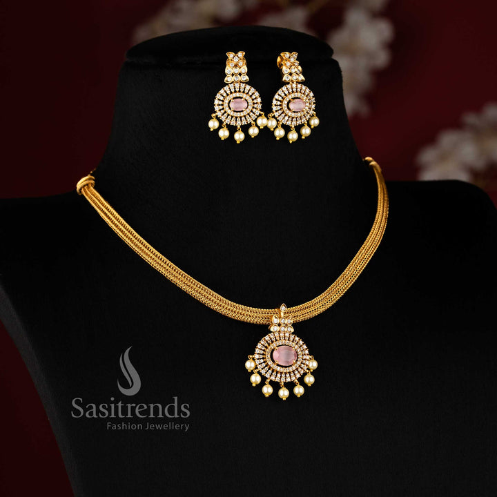 Elegant pink Attigai choker with temple-style floral pendant and matte gold finish – ideal for festive saree looks – Sasitrends